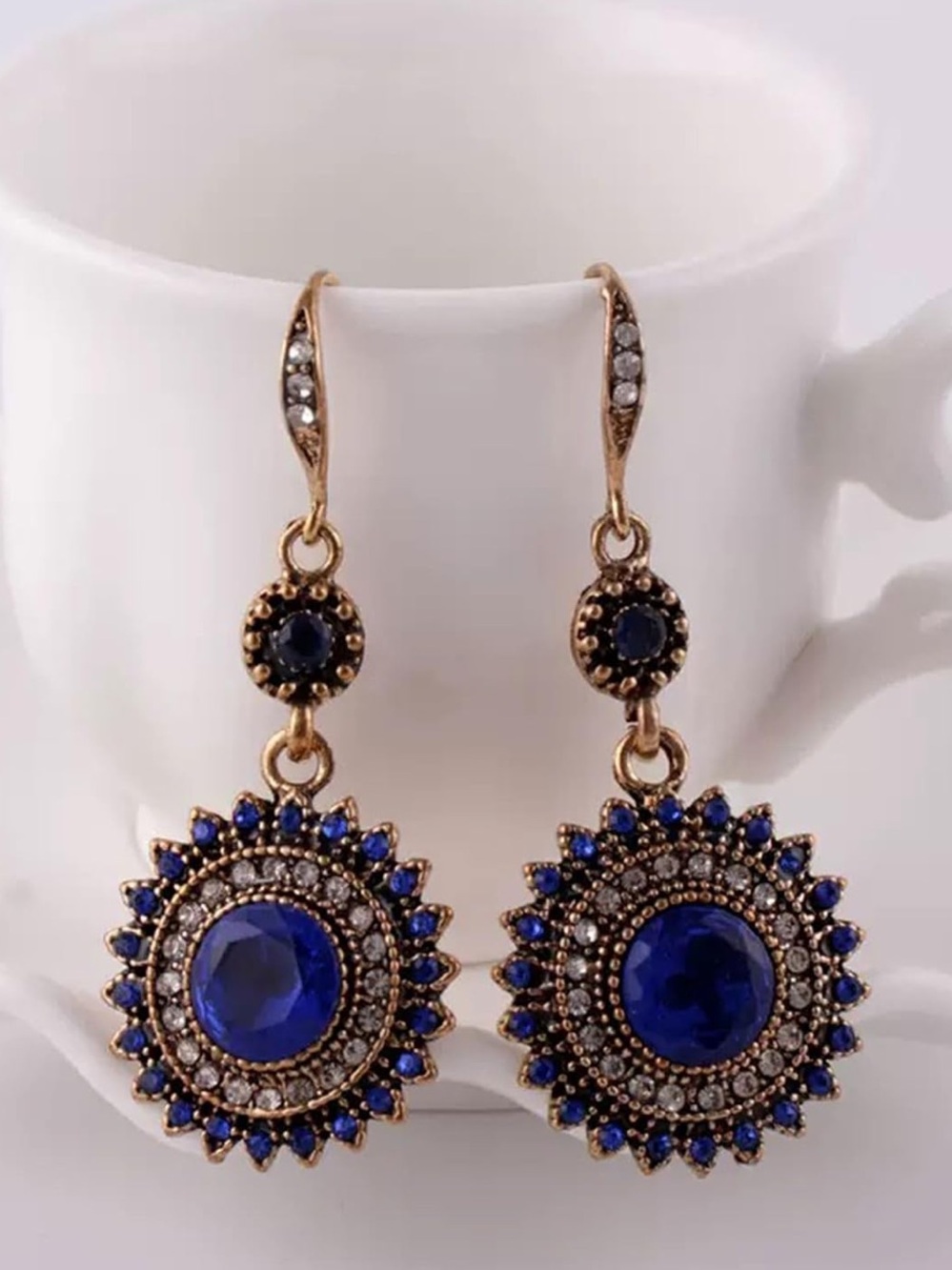 Anthropologie Gold color and Blue Sunburst Drop Earrings